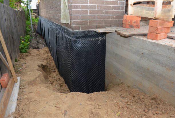 SJ Waterproofing Pros technician performing targeted Emergency Waterproofing assessment in Lansdowne, MD